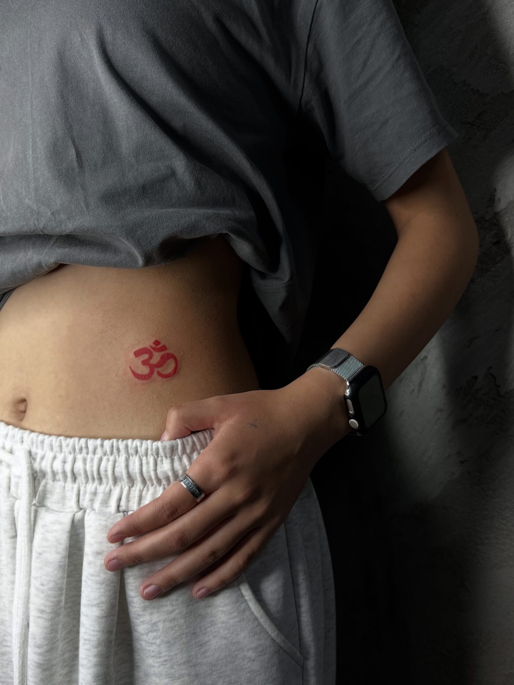 Red symbol tattoo on ribs